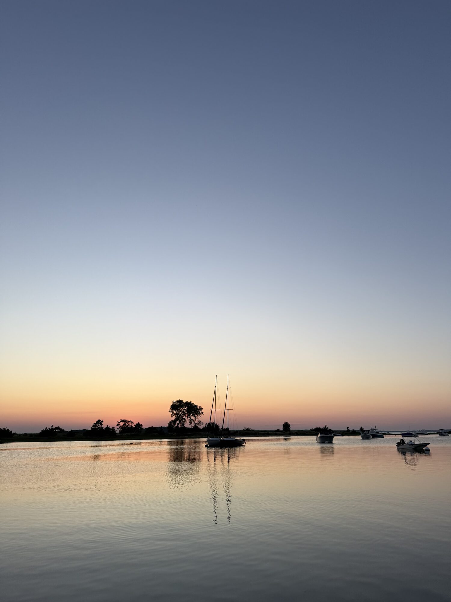 Calm anchorage at dusk in the Hamptons