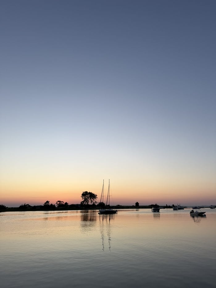 A calm anchorage at dusk