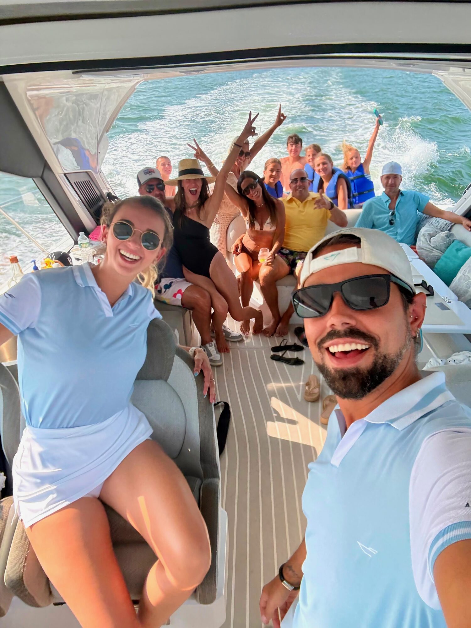 Captain and guests aboard a Yacht Hampton charter