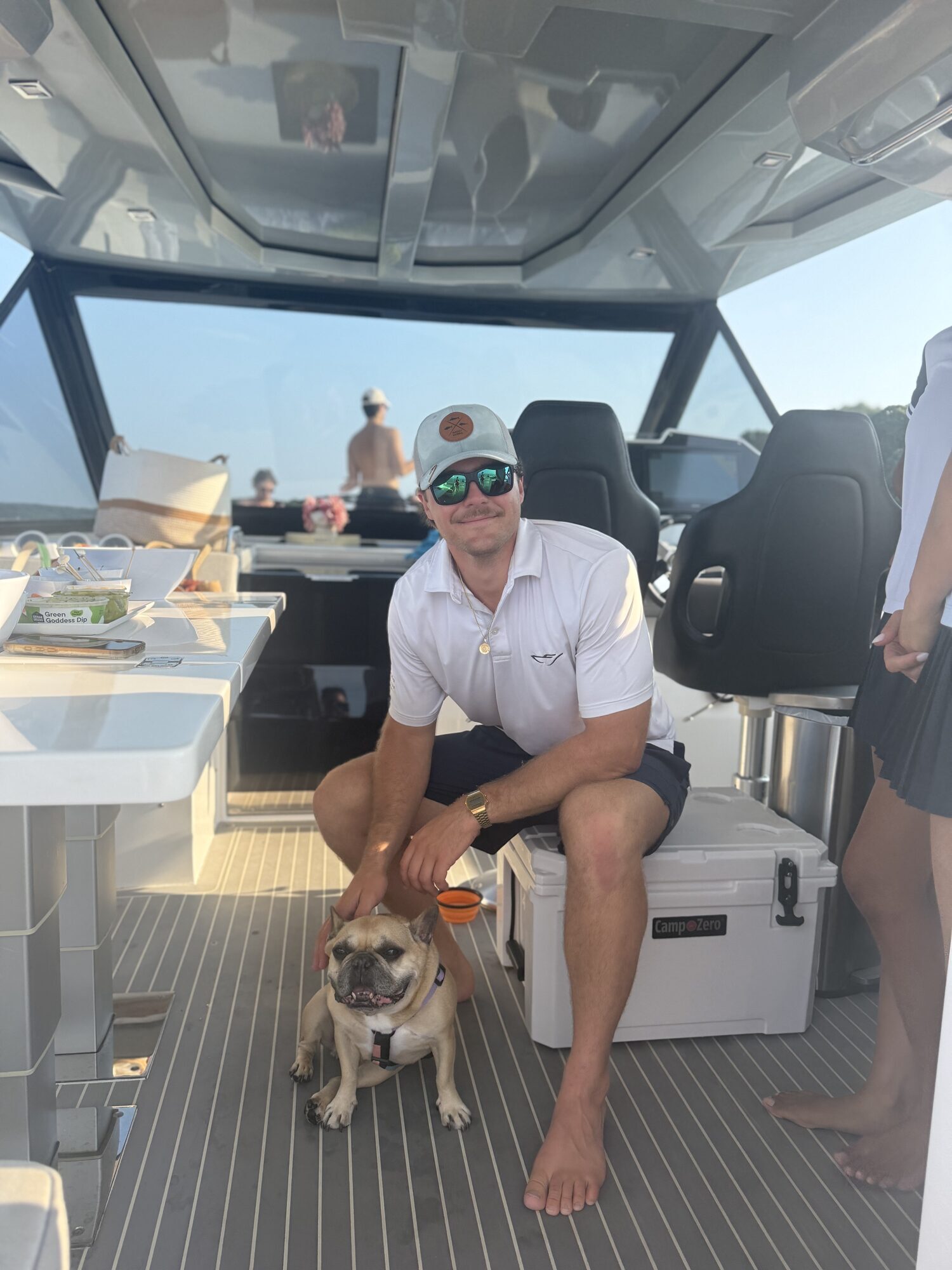 Captain and the ship's dog on the aft deck of a Yacht Hampton charter