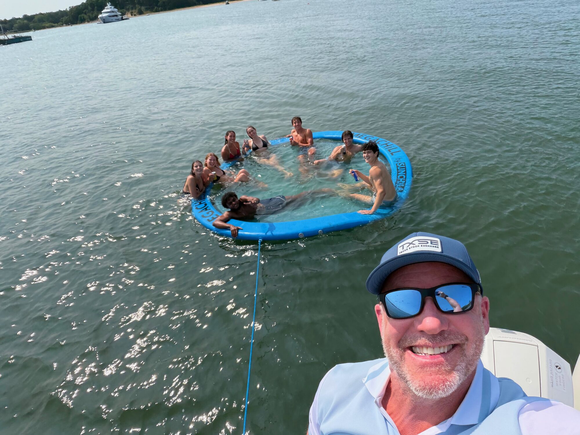 Captain and guests in the floating lounge at a Hamptons sandbar