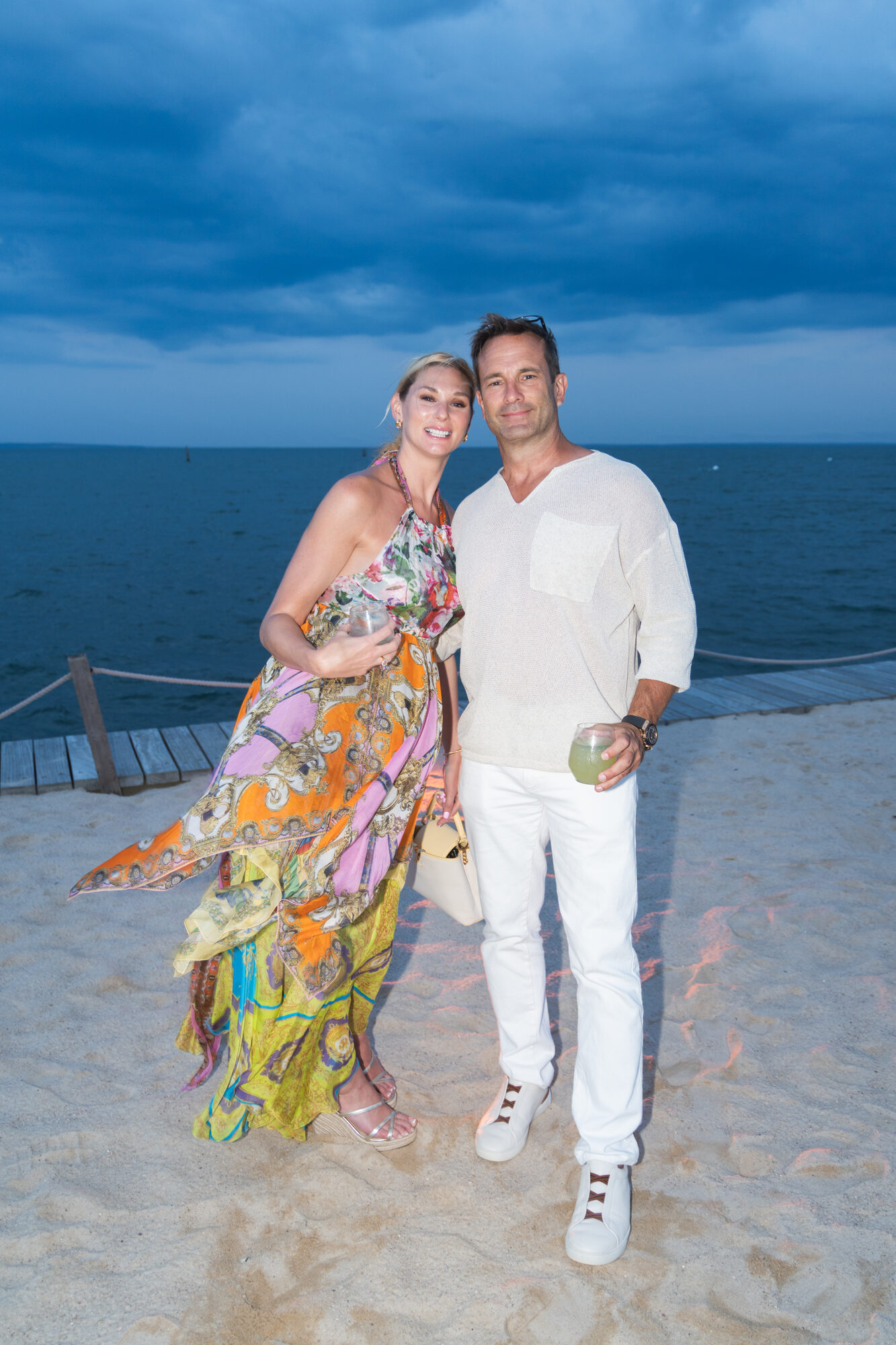 Couple ashore at a Hamptons beach club after an evening charter