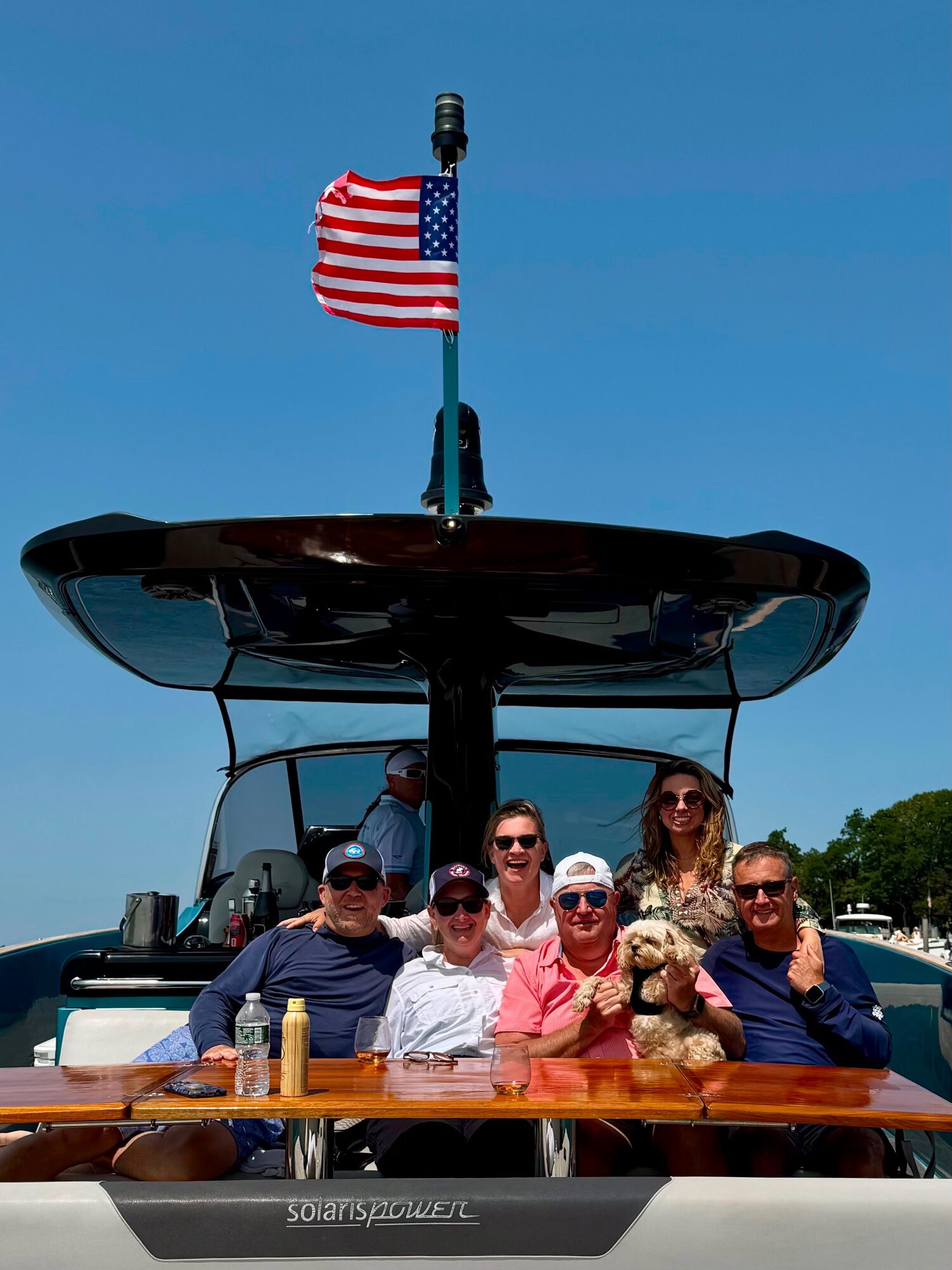 Guests gathered under the flag on a Hamptons charter