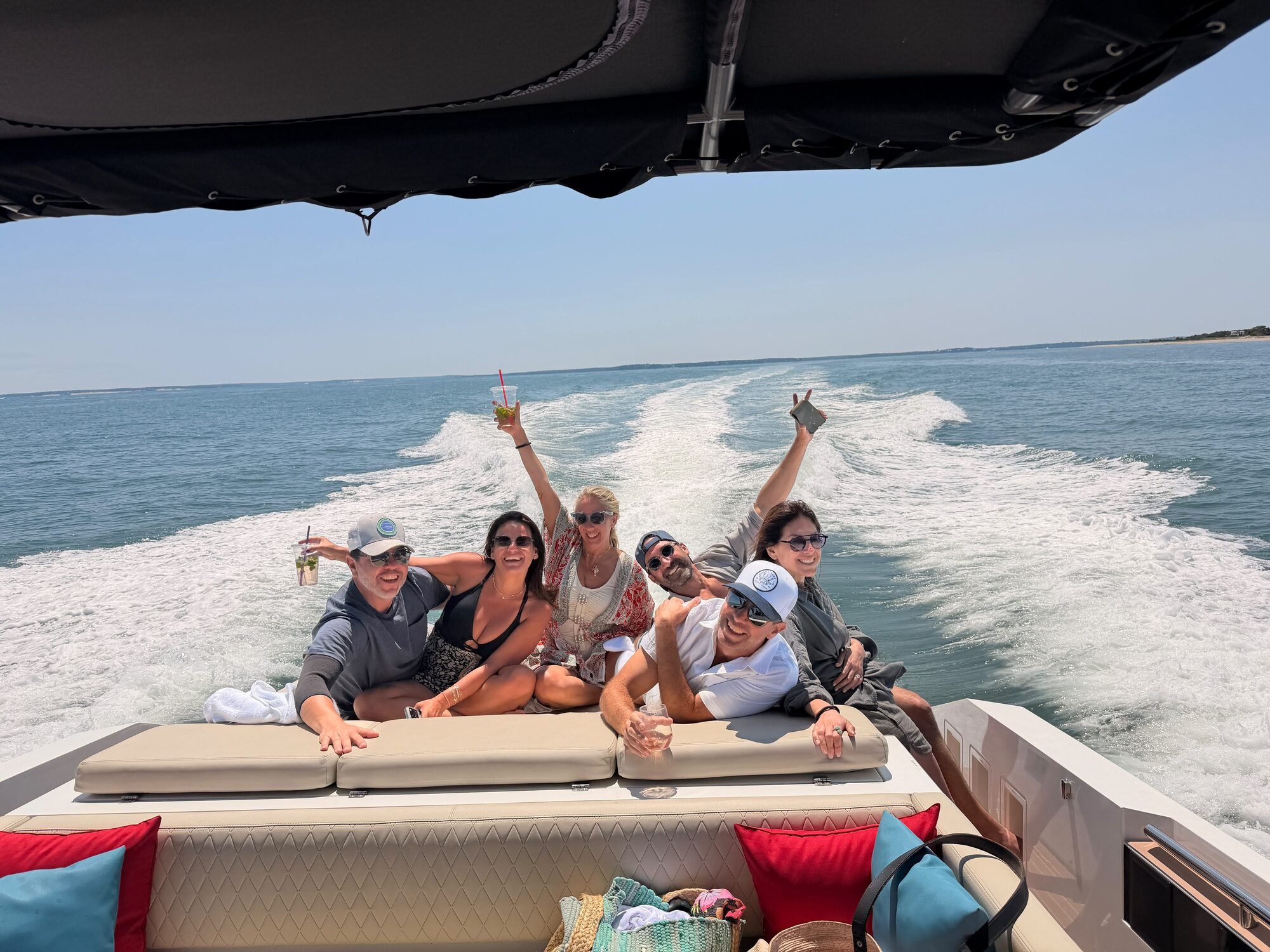 Friends on the aft sun pad cruising the Hamptons