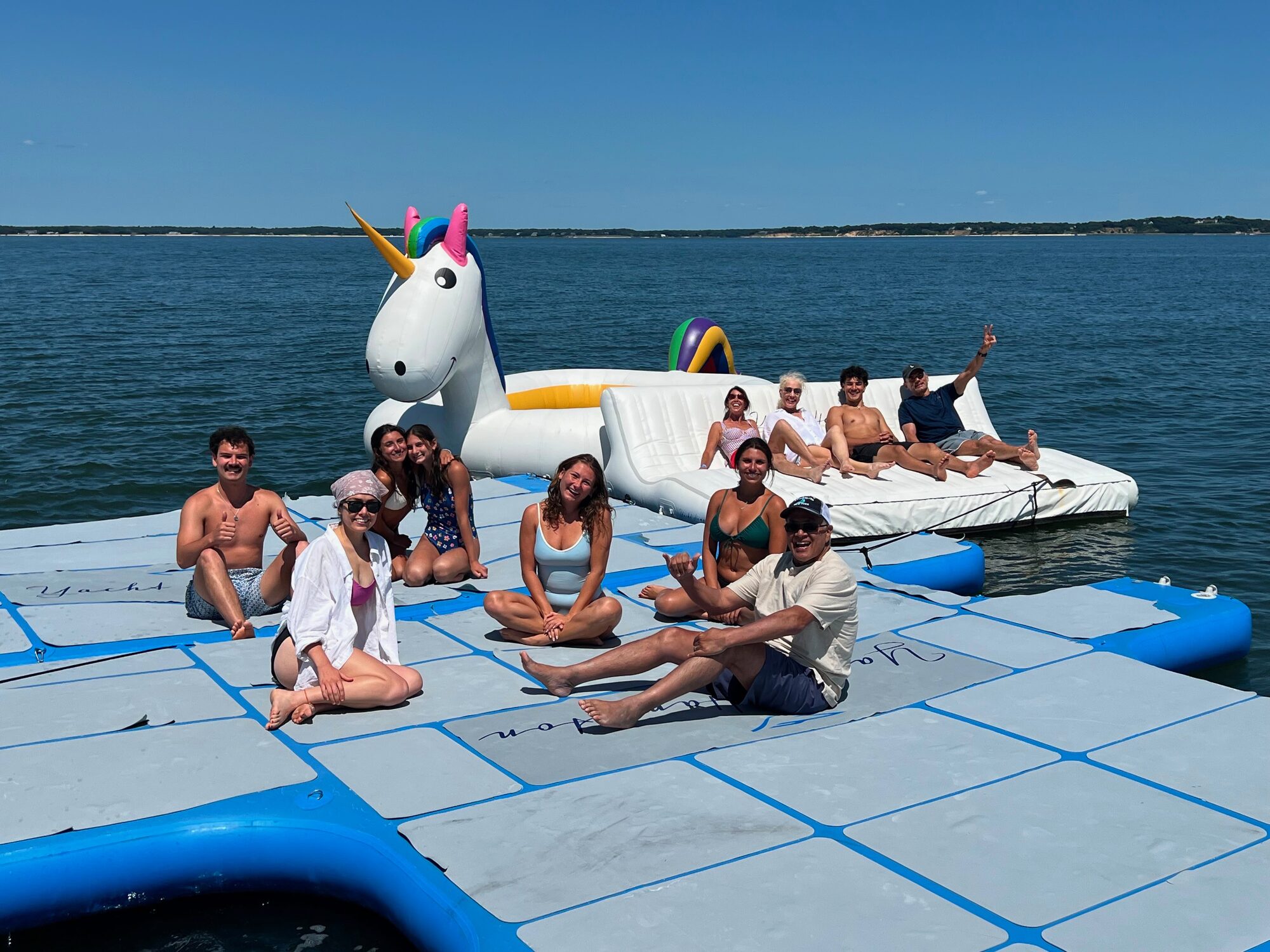 Group hangout on the floating dock at a Hamptons sandbar