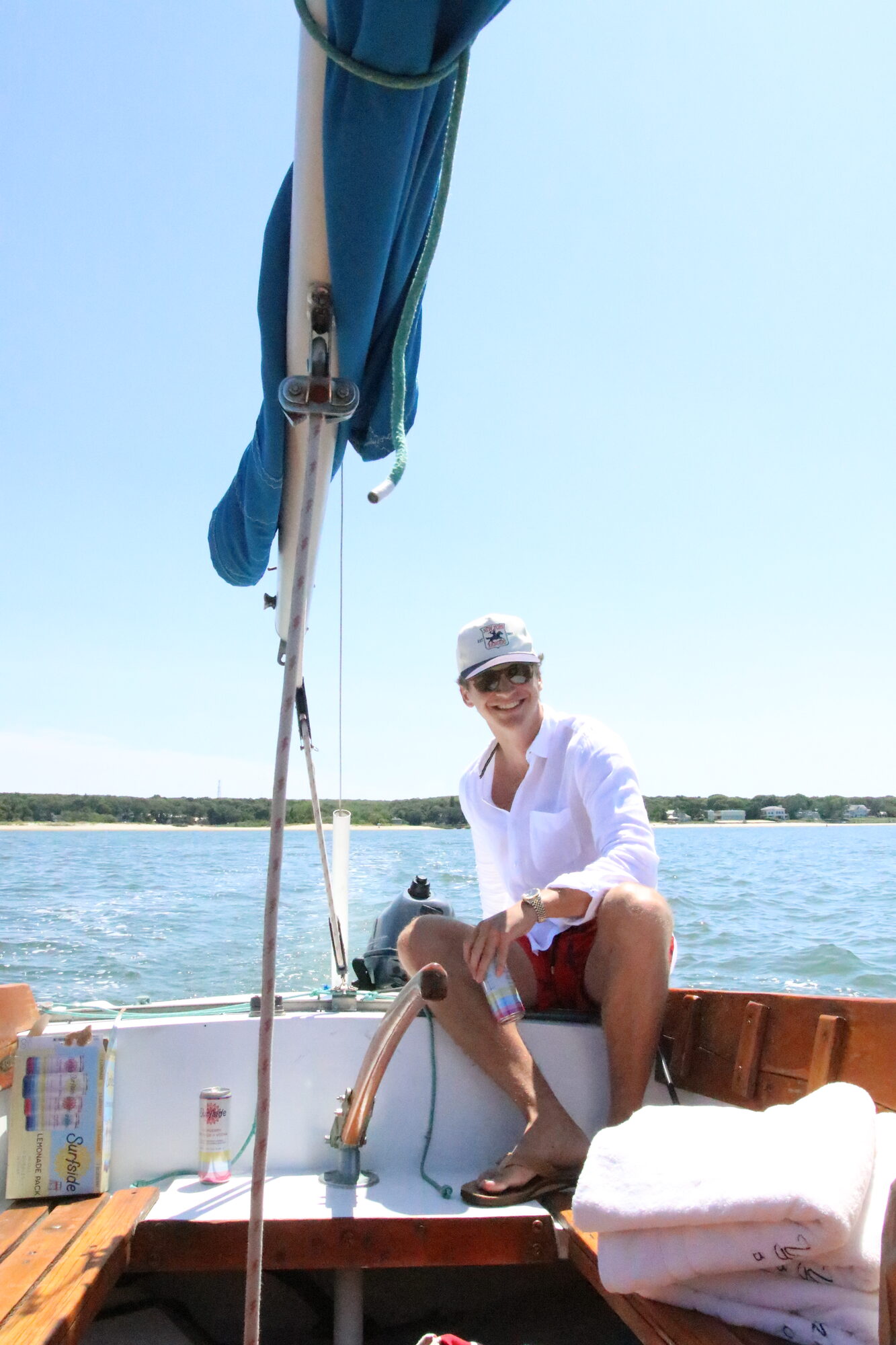 Guest aboard a classic wooden sailboat in the Hamptons