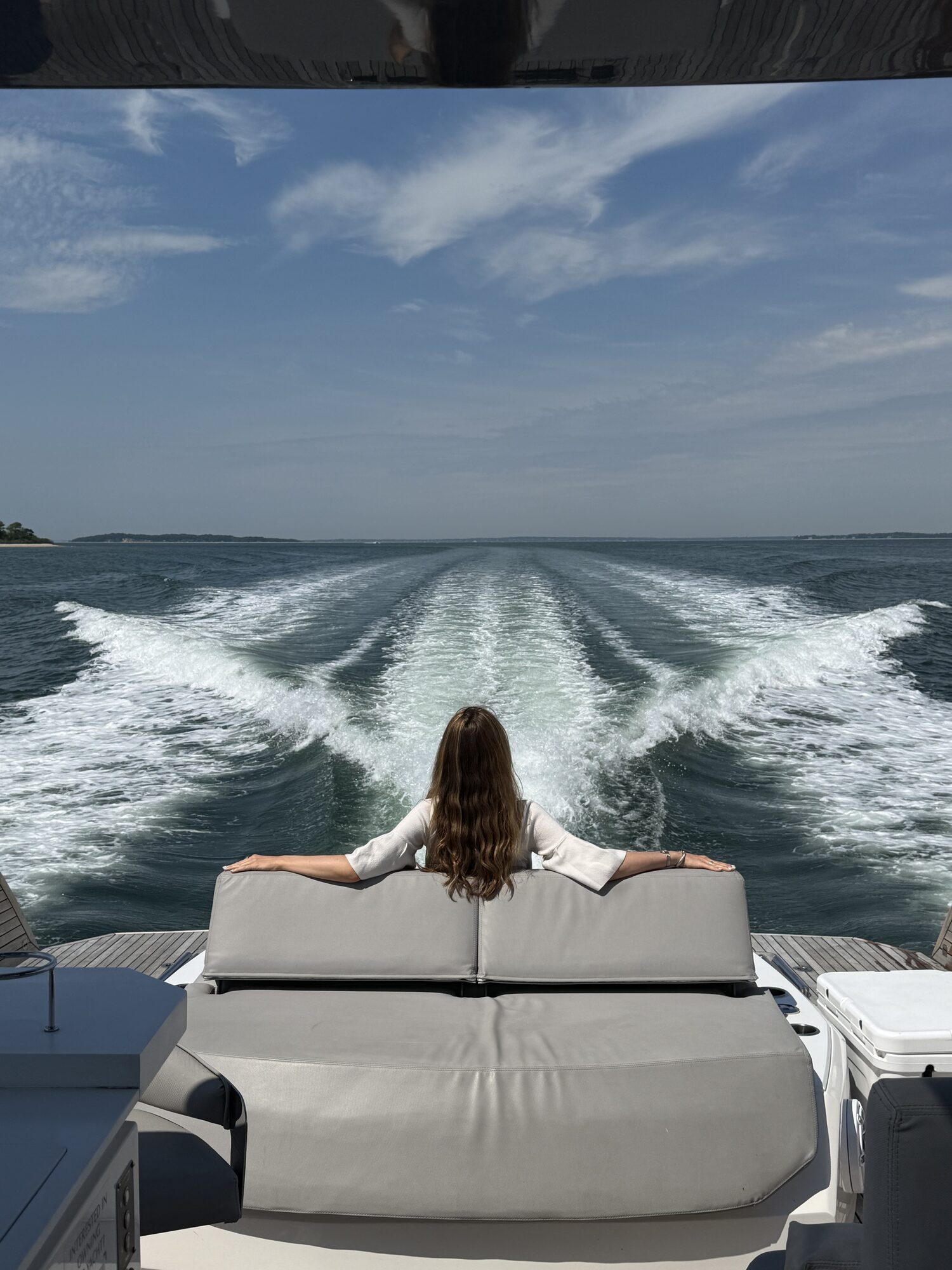 Guest taking in the view from the stern underway