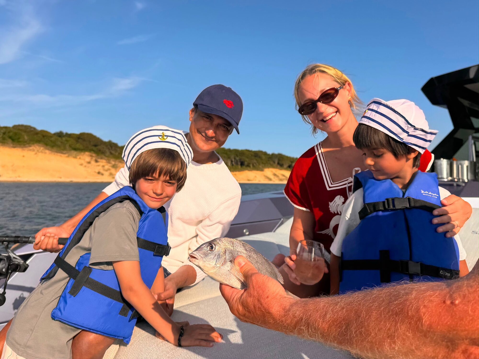 Kids showing off the catch on a Hamptons fishing charter