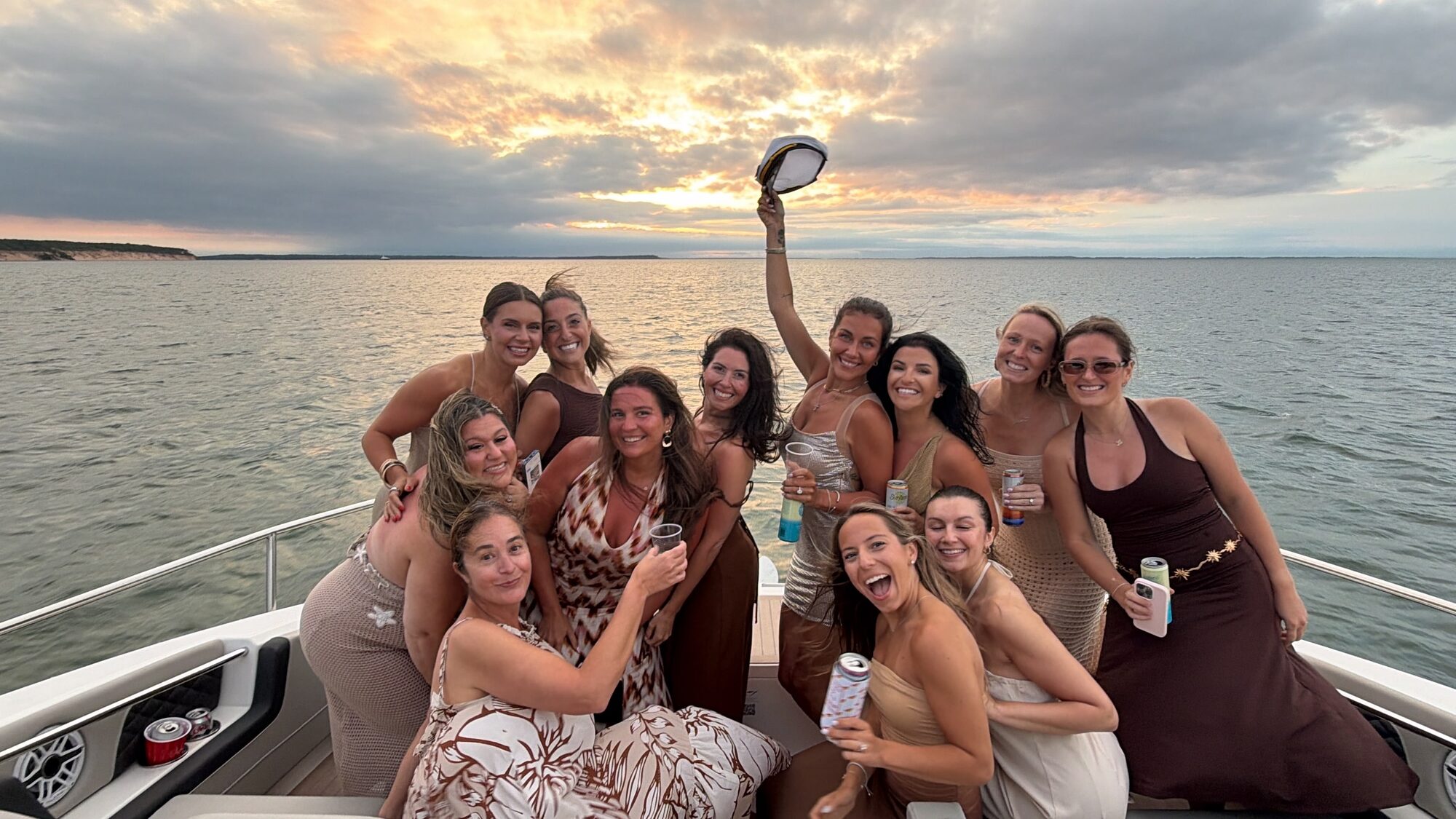 Women's group at sunset on the bow of a Hamptons charter