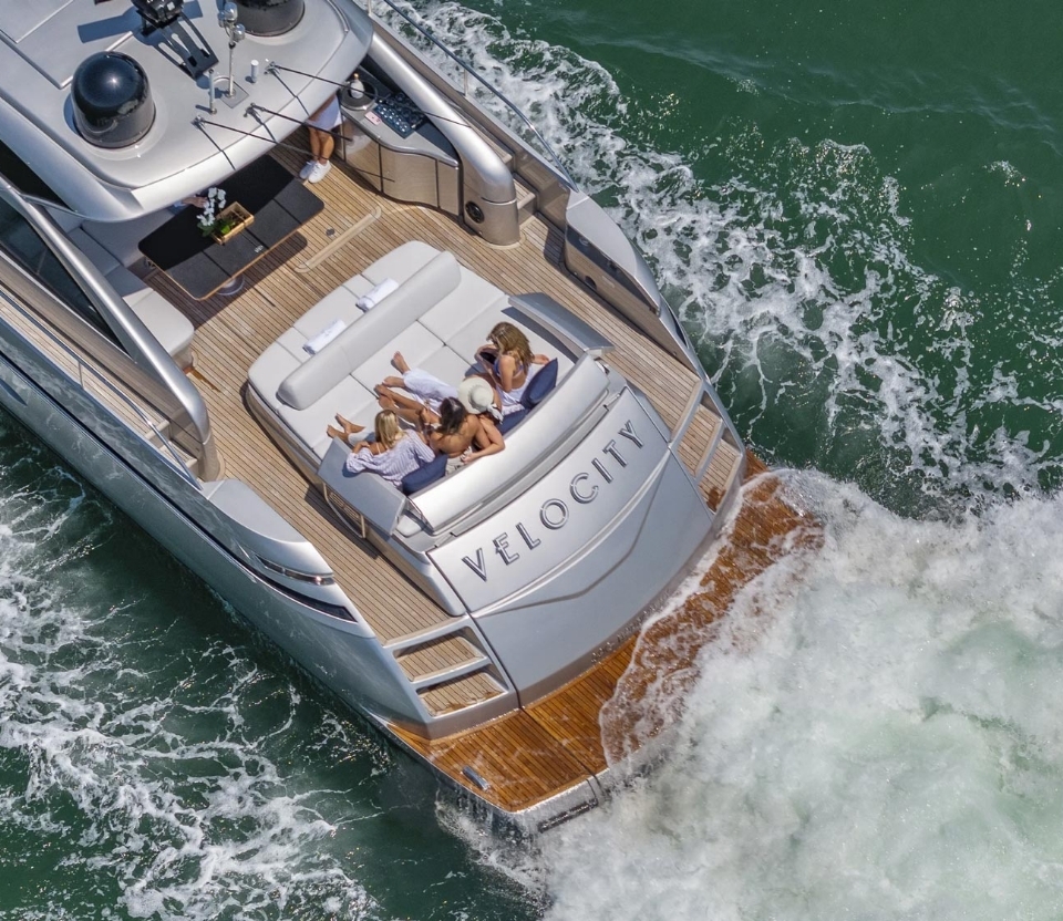 Aerial view of a Yacht Hampton vessel underway with guests on the aft deck