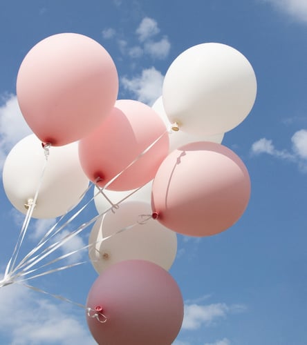 balloons-on-a-blue-sky-background-pink-and-white-2022-11-16-10-06-19-utc-1-1