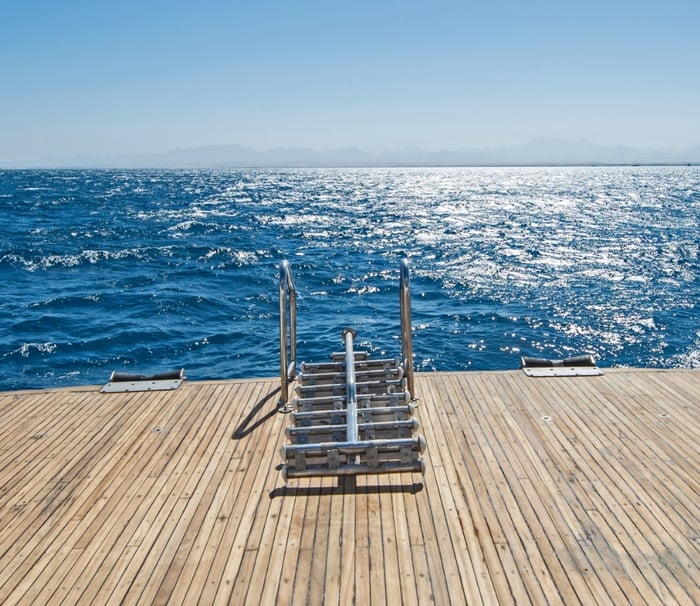 Open ocean seen from the deck of a yacht