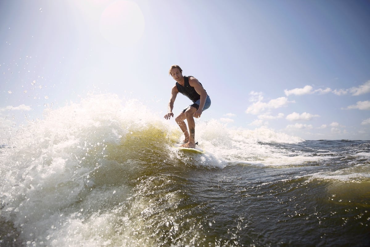 Wakesurfing behind boat in hamptons