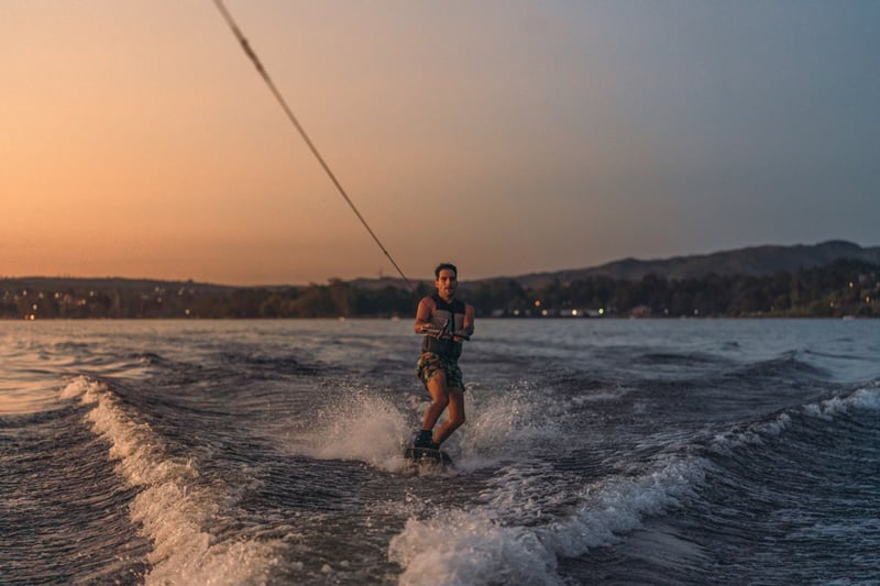 latino-mas-doing-wakeboarding-in-a-lake-with-mount-2022-02-08-15-14-16-utc Large