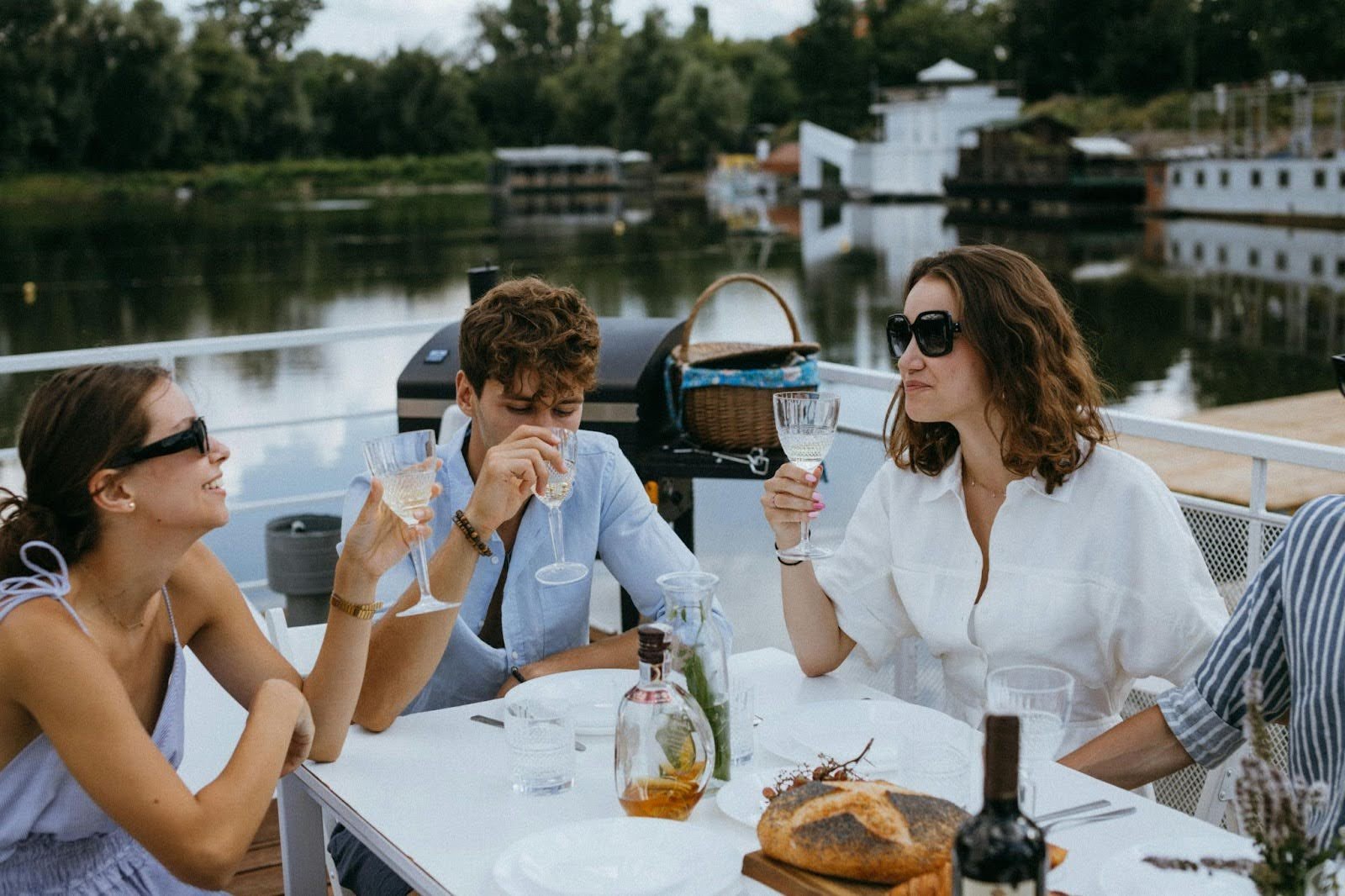 Friends Drinking Wine & Champagne on a Yacht in The Hamptons