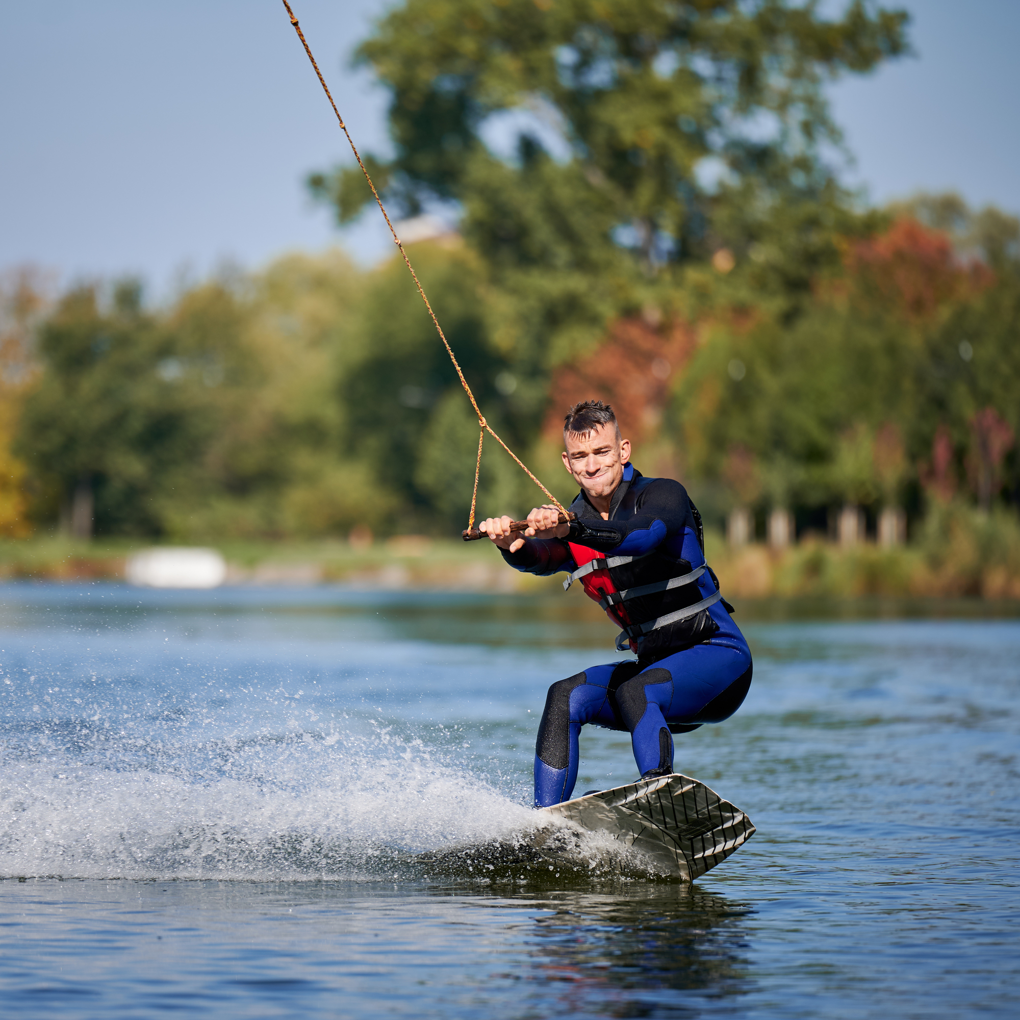 young-surfer-having-fun-wakeboarding-in-the-cable-2022-06-16-19-10-27-utc