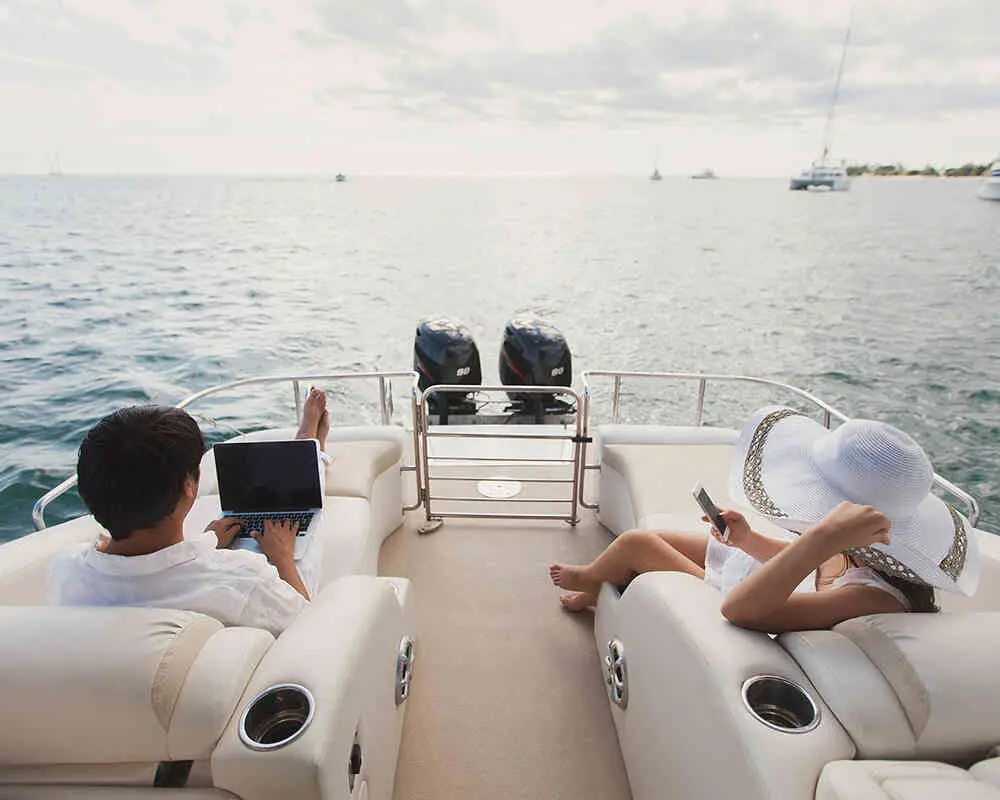 Couple-Relaxing-on-a-Motorboat